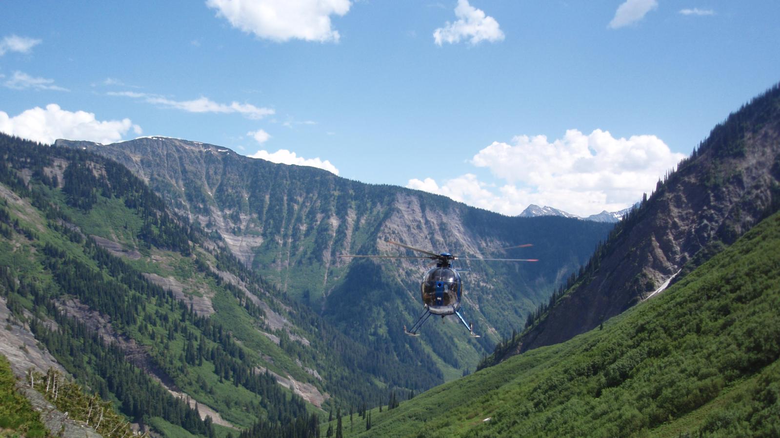 Helicopter arriving for geological crew pick up in the East Kootenays