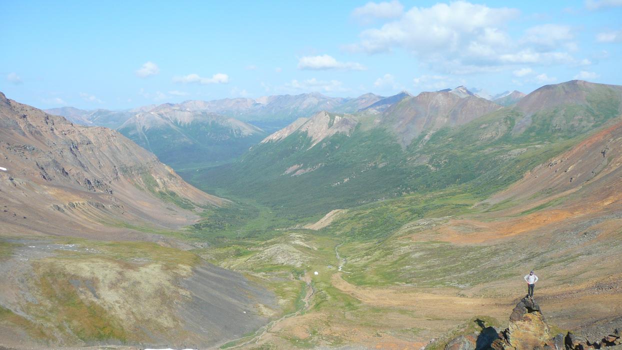 Yukon Mountains Landscape with Geologist in Foreground